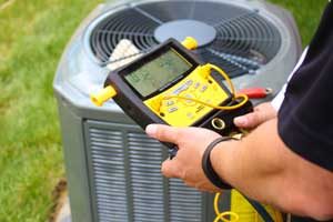 Man inspecting heat pump. All Seasons Heating & Cooling in Vancouver WA provides expert heat pump repair.
