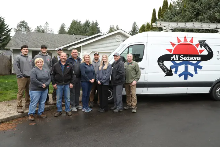 The All Seasons Heating and Cooling Team Standing in Front of Van