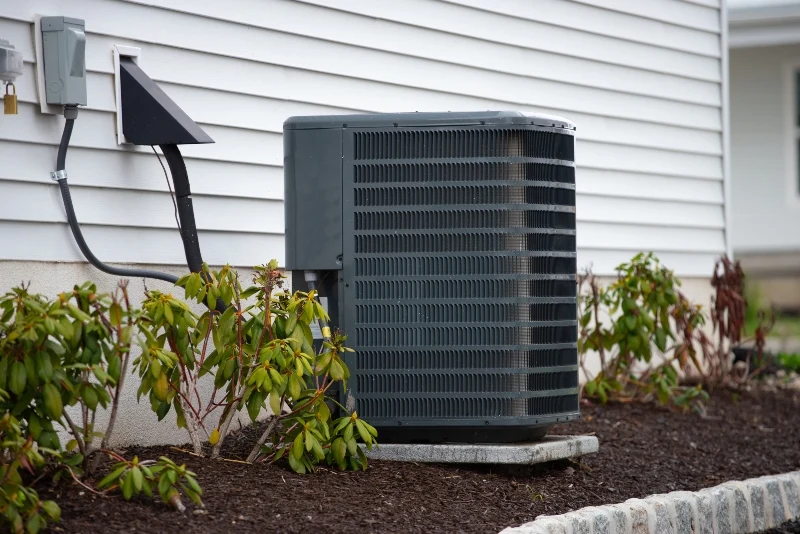 Air conditioning unit on the side of a home