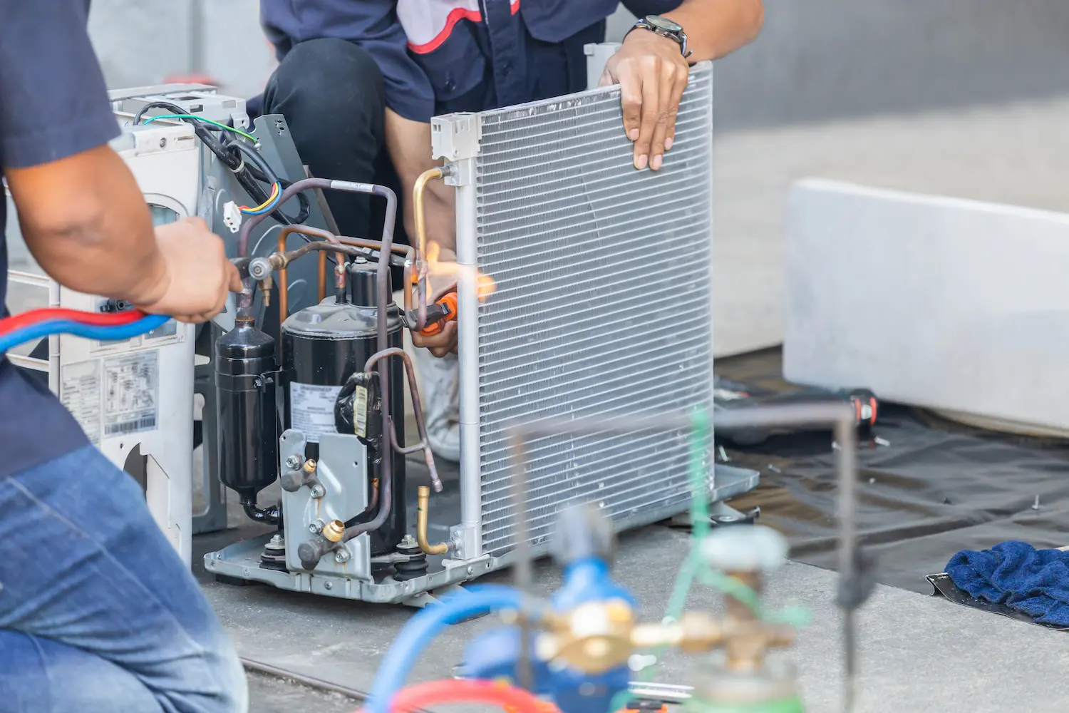 All Seasons technicians installing a new system